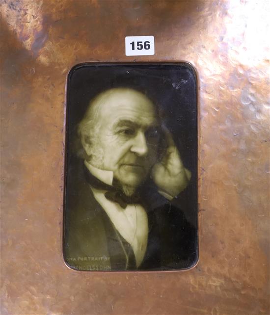 A Sherwin and Cotton ceramic portrait tile of Gladstone in an Arts and Crafts coppered frame